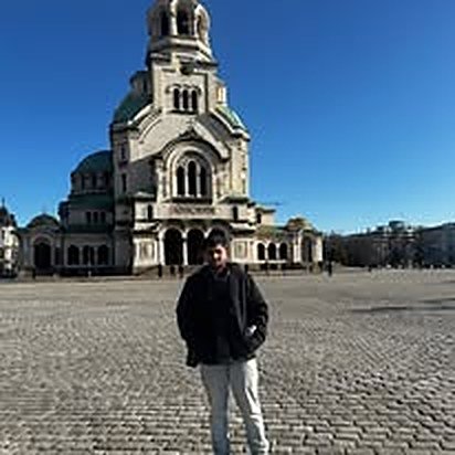Saiful Islam in front of a cathedral square in Sofia